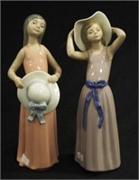 Two Lladro girl with hat figurines