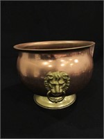 A Brass Jardiniere With Lion Ring Pulls