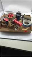 Rolls of tape and 2-tape guns