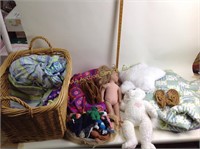 Basket, blankets, plush cat, doll