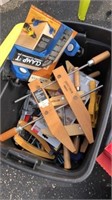 Plastic Tote Full of Wood working clamps