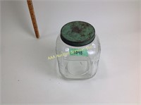 Canister with a green lid