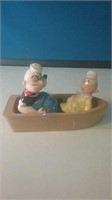 Popeyes salt and pepper shakers in a boat
