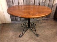 WROUGHT IRON BASE ROUND PINE TOP TABLE