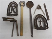 lot of 7 iron trivets, ice cream can lifter & othe
