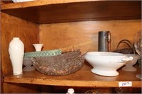 Shelf of glasware, old clock, cans, candle holders