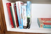 Shelf of books and the board game Password