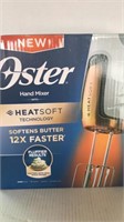 OSTER.  Hand Mixer w/ heat soft technology