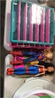 2 dolls and plastic storage