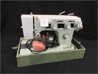 A Sears Kenmore Table Top Sewing Machine