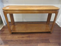 A Contemporary Console Table With Glass Insert