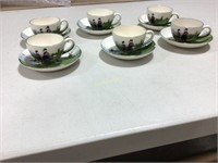 German cups and saucers with Dutch scene
