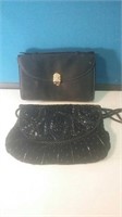 Pair of black party handbags one with black