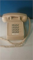 Push button and beige desk phone