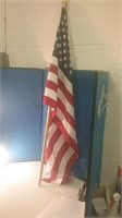 Standard size American flag on wooden display rod