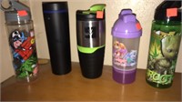 Lot of travel drink ware.
