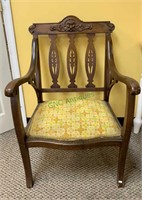 Antique arm chair with carved slats, applied