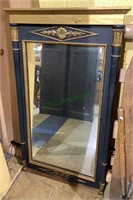 Black and gold wall mirror with Corinthian