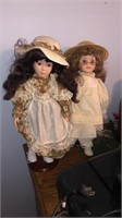 2 cnt. of Porcelain Dolls on Stands