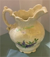 Vintage water pitcher decorated with flowers. 11