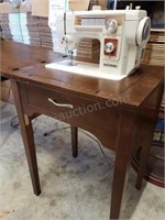 New Home Sewing Machine in Cabinet