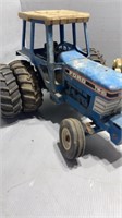 Old metal toys tractor missing front wheel