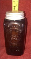 Amber Quart jar with tin lid w/markings