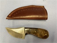 Damascus bladed skinning knife with wood scales an