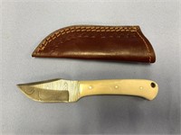 Damascus bladed caping knife with bone scales and
