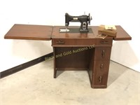 White sewing machine in great mid-century cabinet