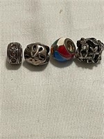 Four Sterling Silver Beads