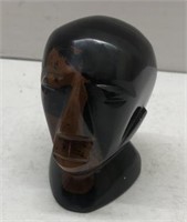 Polished stone head figure