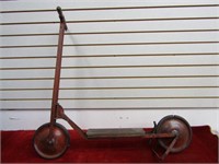 Antique pressed steel scooter.