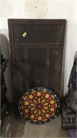 Dart board and wooden door