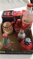 Coke bottles and mug