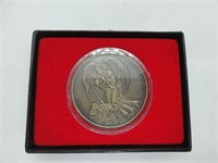 Angel and nativity coin