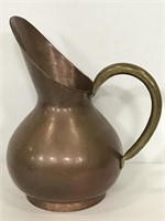 Vintage copper pitcher with brass handle