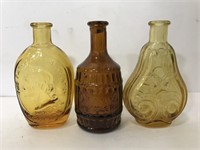 Three vintage small brown bottles