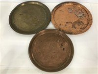 One brass and two copper vintage trays