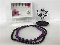 Two jewelry holders with two beaded necklaces