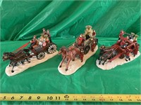 (3) DEPARTMENT 56 STYLE HORSE DRAWN / FIRE WAGONS