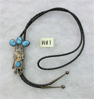 HH1- sterling Kachina Bolo w/turquoise holding a