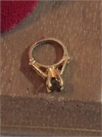 14 K yellow gold baby ring charm with brown amber