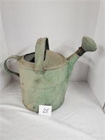 Vintage metal watering can