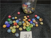 Mason jar of older marbles