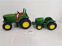 pair of John Deere tractors