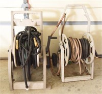 Lot #4214 - (2) hose reels with hose (1) pocket