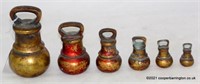 A Set of Six Antique Brass Bell Weights