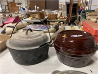 Ditch oven with broken lid and pottery dish with