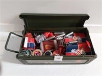 A Metal Box With Assorted Pellets
